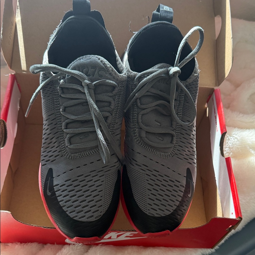 Nike Gray and Black Athletic Shoes
Size 7 kids which fits size 8 to 8 1/2 women